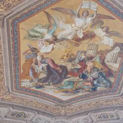 Paintings depicting angels adorn the ceilings