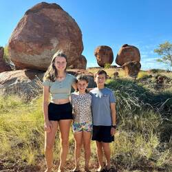 Posing in front of the rocks Mama and Papa climbed on 21 years ago - no longer allowed