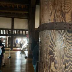Two huge wooden pillars support the tower.