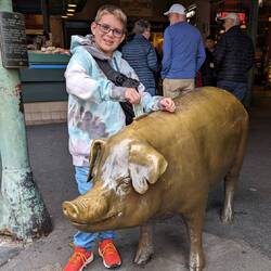 Me feeding the piggy bank money.