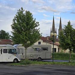 Motorhome Aire with view of the church and convent bell towers