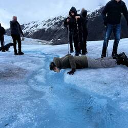Vincent drinking pure, icy, and refreshing Mendenhall Glacier water.