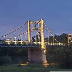 Bridge next to the parkup is lit up at night