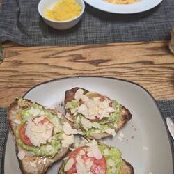 Worst breakfast to date, peanut butter, weirdly creamy avo, tomato (ends) & raw almonds