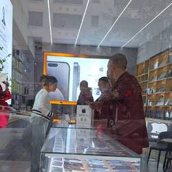 Monks in the mobile phone shop