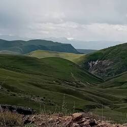 View at the top of the first climb. Snow-capped peaks in the distance, a gorge coming soon.