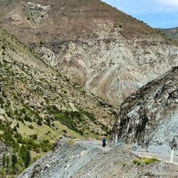 Small cyclist amongst grand scenery