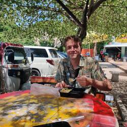 Enjoying our complimentary meal after getting past the border. We're in Cambodia!