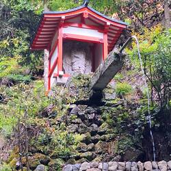 A fountain pretty high above on a hill