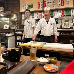 Demonstrating sushi making.
