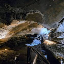 A river/small stream runs through the cave