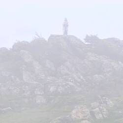 Virgin Mary statue in the mist