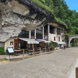 Entrance gateway to the abbey and several shops built into the caves along cliff sides