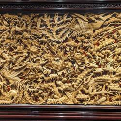 Two phoenixes being greeted by all the other birds of the forest