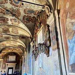 Frescos in the university showing crests from families and locations students were from