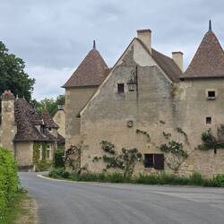 Large house stands at the village entrance