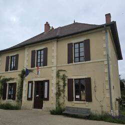There is a brocante (junk/antique) shop which also doubles as baguette shop in the centre
