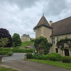 One of the Château 5 towers is visible from the village