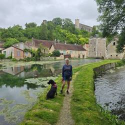 Walk between the pond and stream, with views of village and Château