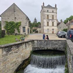 Weir and mill building in the village