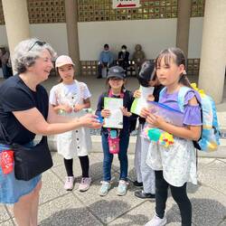 Kids asking Judy questions for a school project