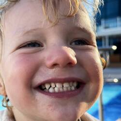 Happy boy to be in the pool!