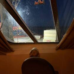 Watching the crane moving the containers