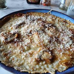 Pannekoeken -.dutch pancake, mine was savory with mushrooms, onion and Parm. Yum!