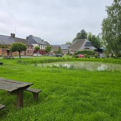 The village has a traditional centre with Marie and pond