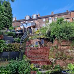 Painted sandbags and wooden windows give a castle feel to this garden