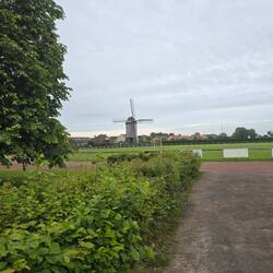 View of the windmill from across one of the village stadiums