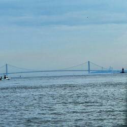 Verrazano Bridge with West Bank Lighthouse right side. Coming around Sandy Hook