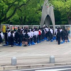 Schoolchildren paying their respects at memorial in Hiroshima