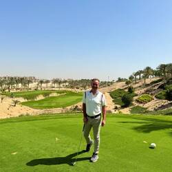 Birthday boy with big smiles on the course
