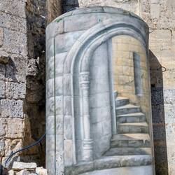 Painted tank containing a shower.