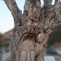 600 year old olive tree carved as hippie Anthem to Matala - peace, love, friendship