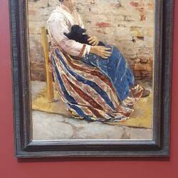 Alte Frau mit Kätzchen.