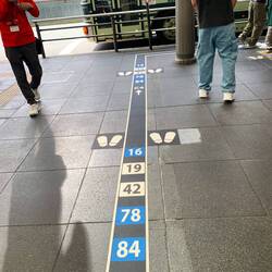 The very orderly system for queuing up at the bus depot
