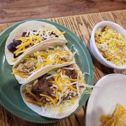 Tried Mexican mush. Beef, black beans, onion, tomato, potatoes. Dawn's is the "small" burrito bowl.