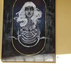 I can't tell if I have double vision or the model does. I think it was the artist who did.