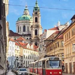 The steeple of St Nicholas Church viewed from the street walk near our accommodation plus city tram