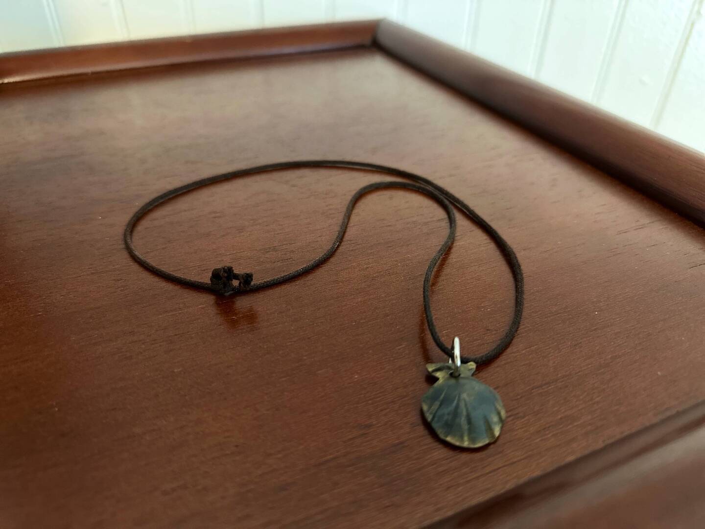 This necklace holds the stories of two pilgrims already! It's about to hold one more.