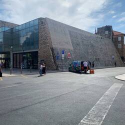 Old city wall is part of modern building