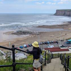 Vela standing on some more stairs