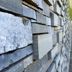 One raised brick in wall for each dead fighter.