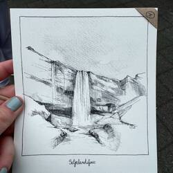 I got a little art piece made by a local artist of my favorite waterfall here in Iceland.
