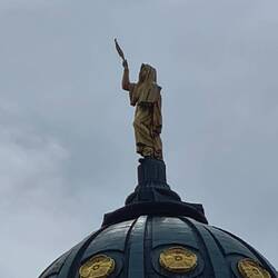 French church, holding feather 🪶