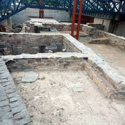 Renovation on a church discovered an ancient home belonging to someone of wealth. It had thermal bat