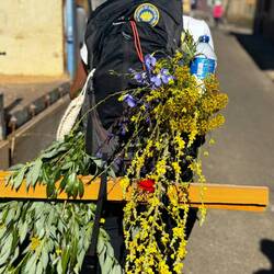 Young Swedish pilgrim who celebrates the summer solstice with flowers
