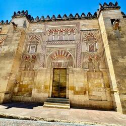 Moorish architecture and graffiti around the outside of the mosque-cathedral.